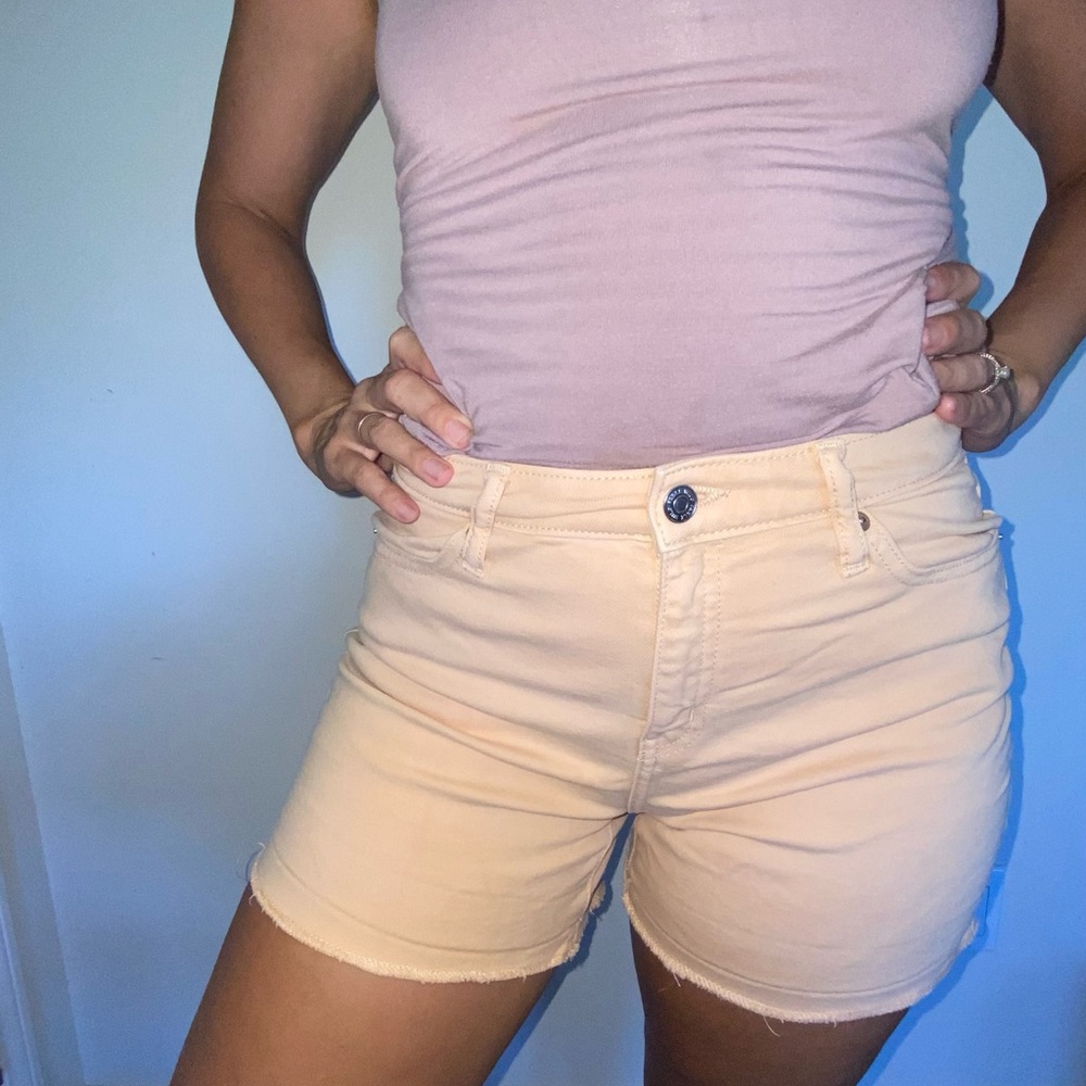 Cream colored jean cut-offs